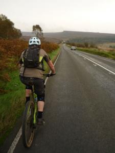 Brian on the long A6187 climb from Hathersage.